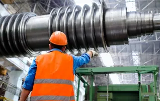 Industrial engineer wearing an orange hard hat
