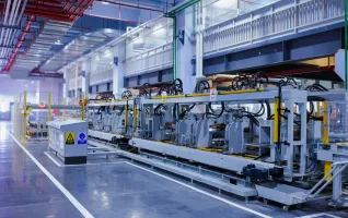 a view of a large machine in a large building working fully automated