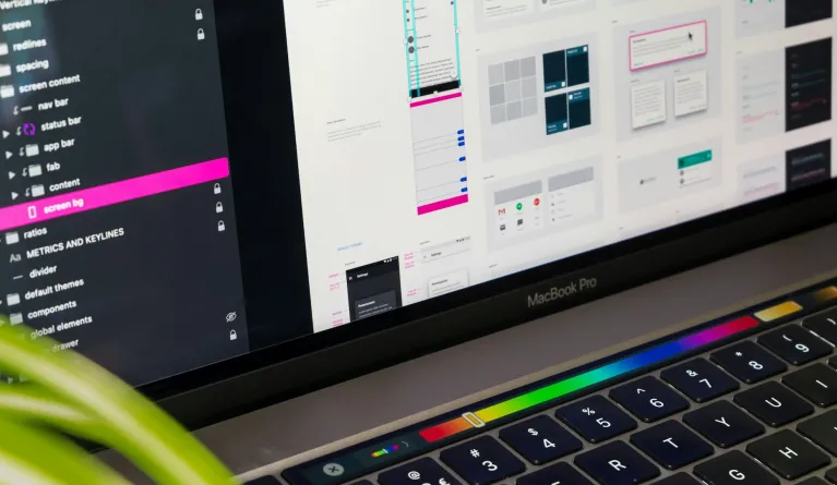 macbook pro screen displaying someone working on UX design