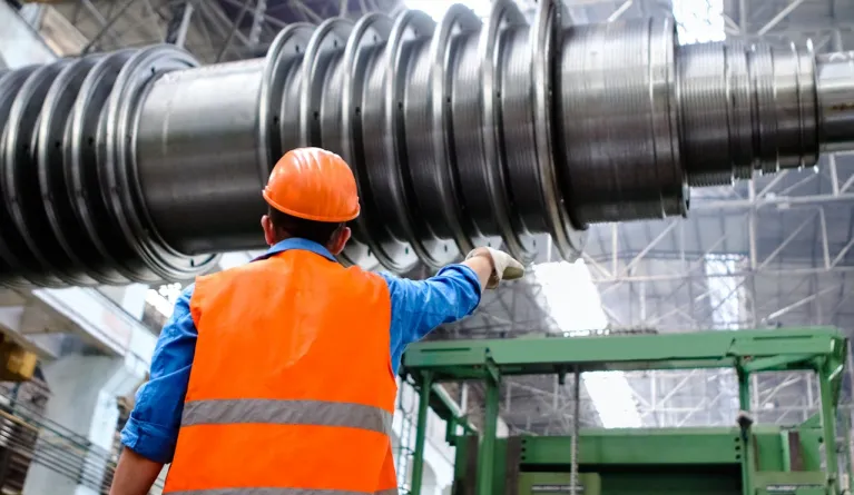 Industrial engineer wearing an orange hard hat