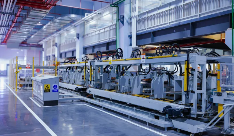 a view of a large machine in a large building working fully automated
